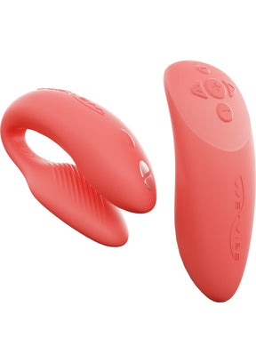 Two red silicone toys on a white background
